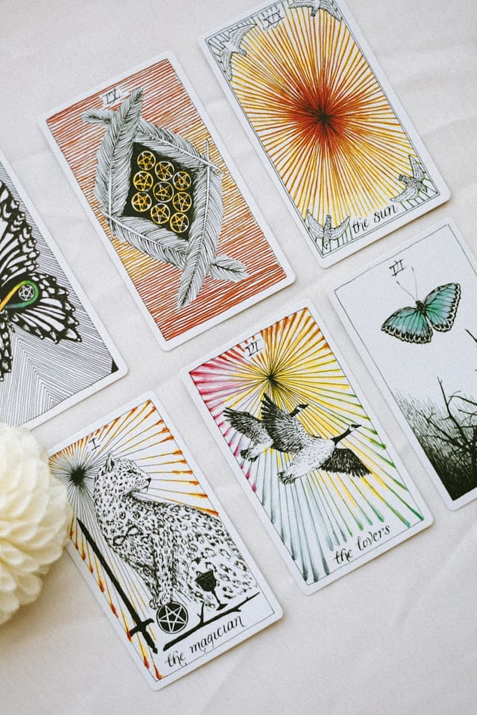 a bunch of tarot cards that are on a table