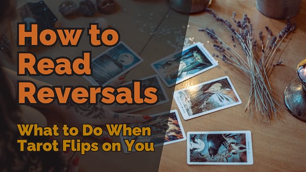 A tarot reading setup on a wooden table with reversed tarot cards scattered. A hand with tattooed fingers rests near the cards, and dried lavender lies beside them. The image has bold text overlay reading “How to Read Reversals: What to Do When Tarot Flips on You.”