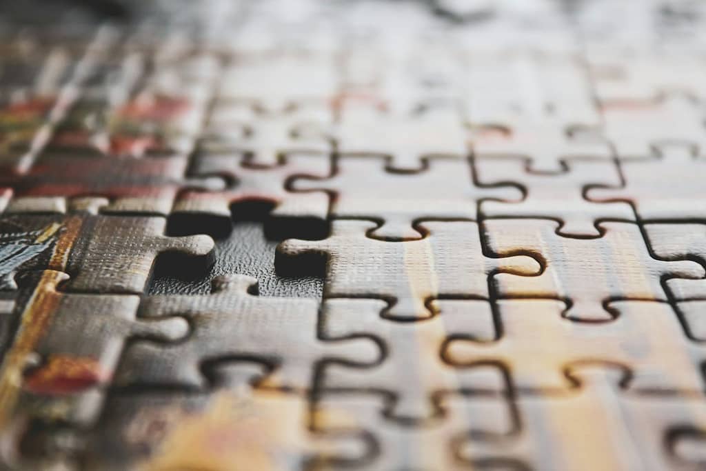 How The Enneagram And Tarot Work Together 3 A close-up of a jigsaw puzzle with a missing piece, symbolising how combining tarot with the enneagram can reveal what’s been missing in self-understanding.