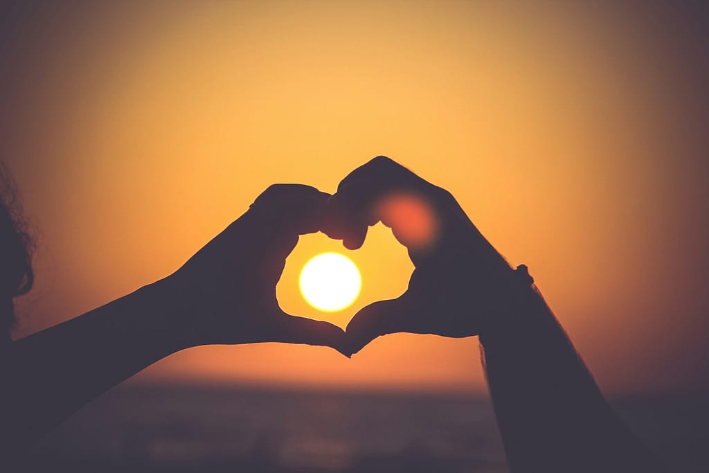 The Perfect Valentine'S Tarot Reading For Your Love Life Silhouette of person's hands forming heart