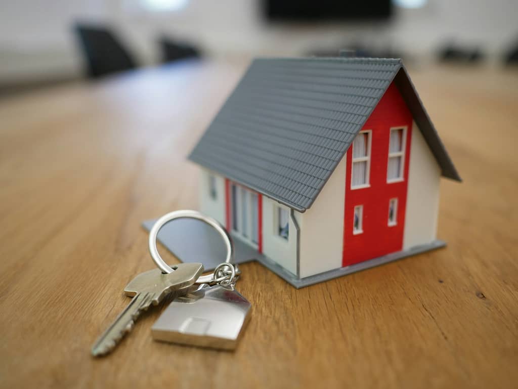 The One Question That Can Transform Any Tarot Reading White and red wooden house miniature on brown table