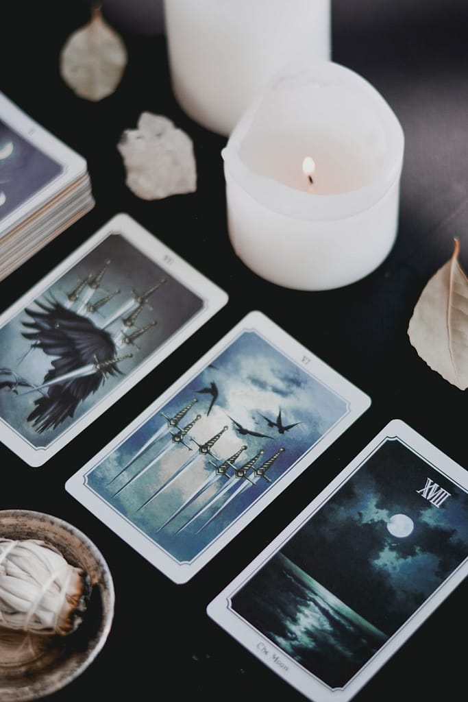tarot Cards and candle on black background