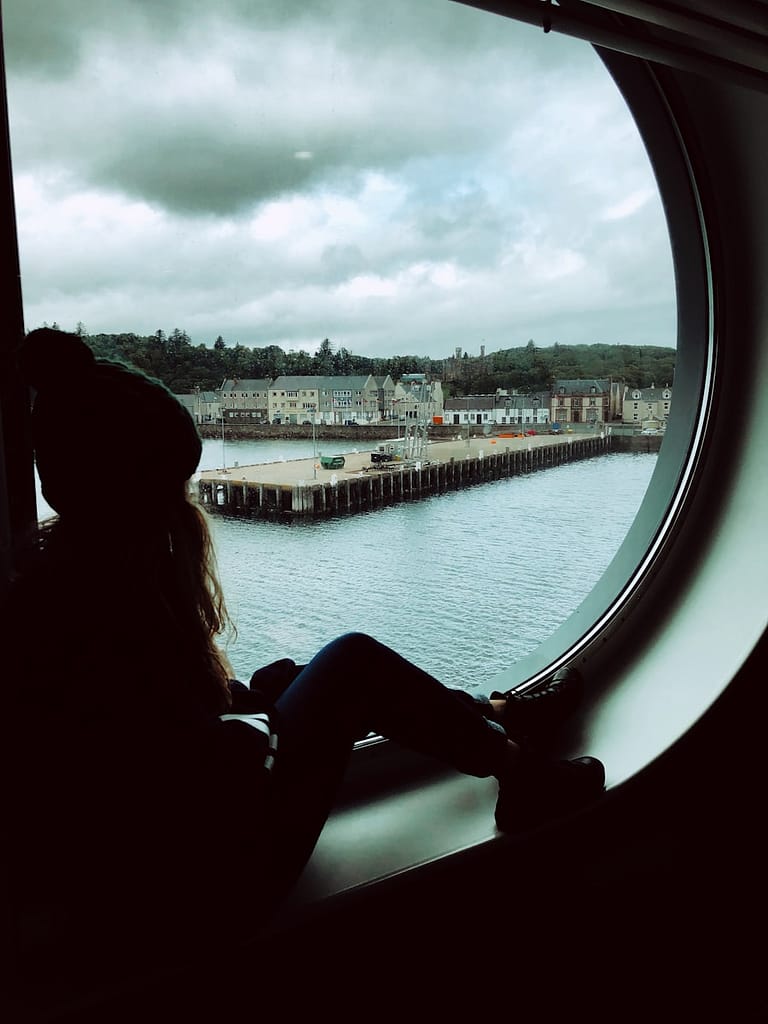 What Not To Ask A Tarot Reader? 7 Questions To Avoid Woman sitting on window