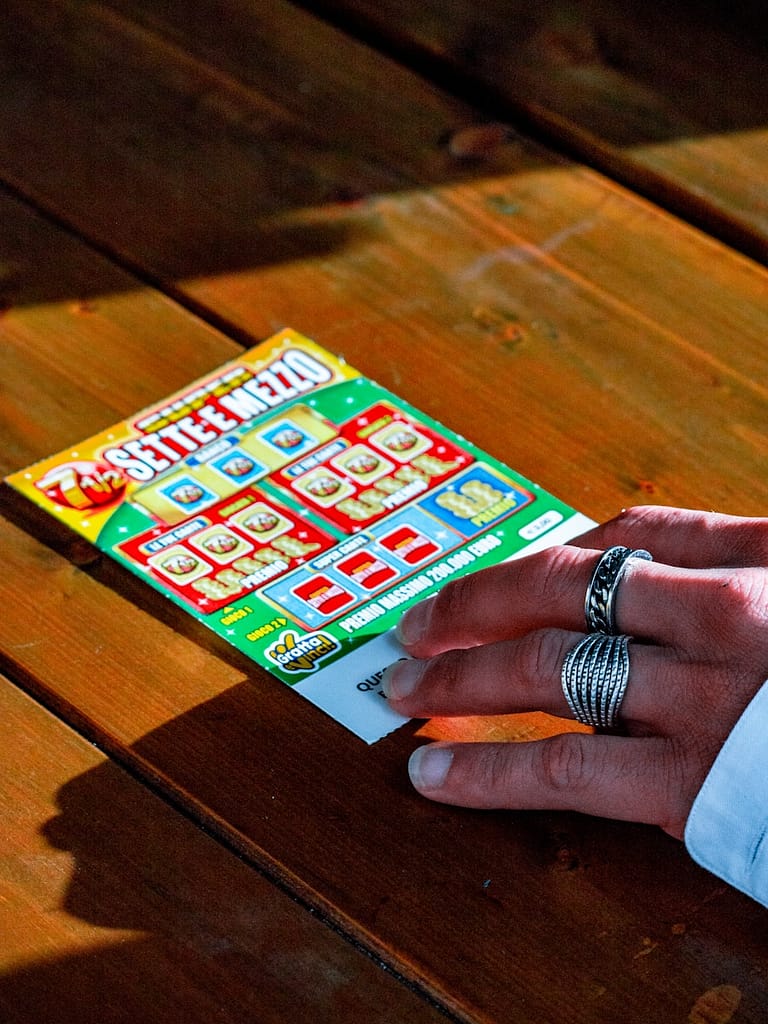 What Not To Ask A Tarot Reader? 7 Questions To Avoid Person in white long sleeve shirt holding lotto ticket